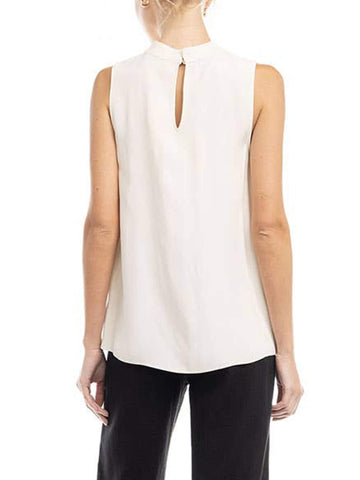 Backside view of woman wearing a sleeveless white blouse.
